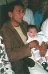 My baptism on my godfathers legs